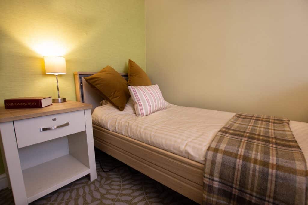 A stylish Blue Leaf designed bedroom at Featherton House senior living residence near Banbury.