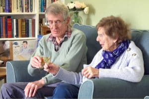 Residents of Featherton House Care Home in Deddington enjoying a pre-dinner drink in the lounge.