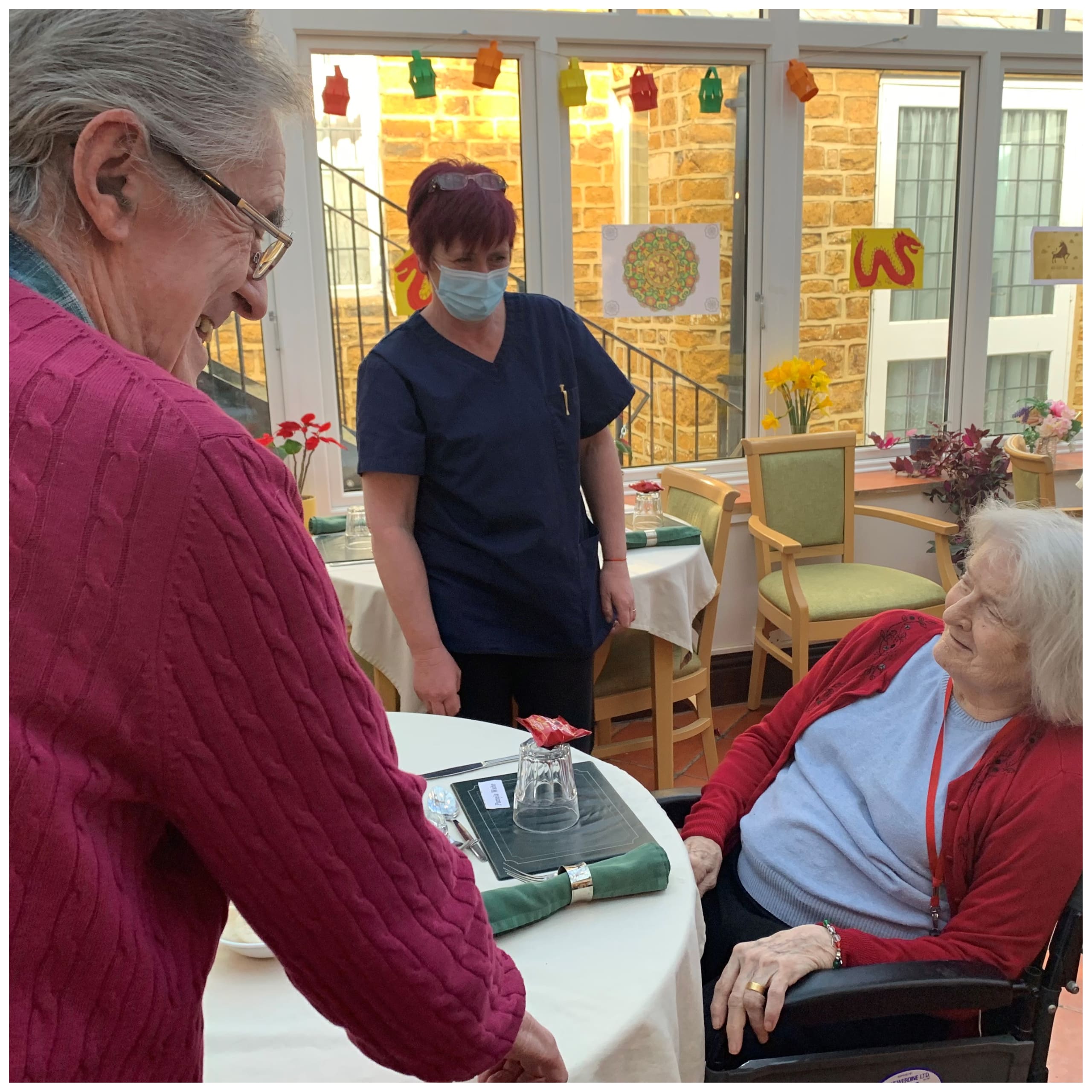 Featherton House Care Home residents and staff in the dining room ready for their Chinese New Year banquet.