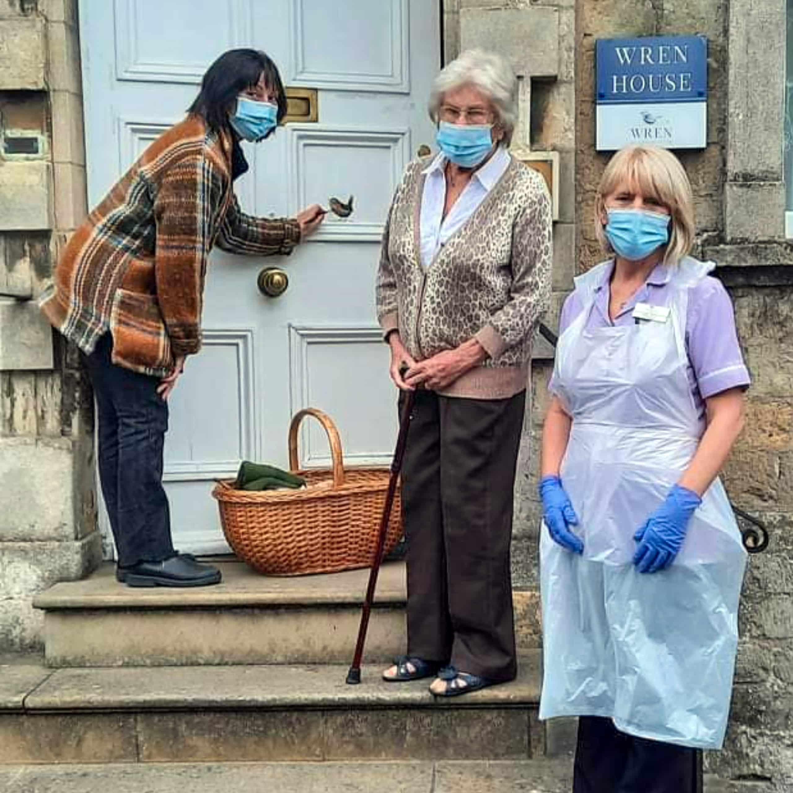 Local artist Tanya Hinton with her bird art creation on the entrance to Wren House Care Home. With resident Pauline Taylor and staff member Justine Hicks.